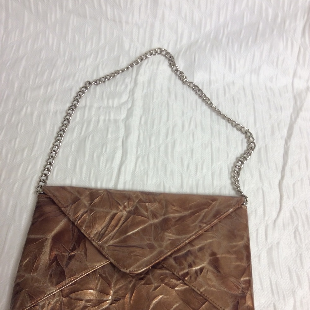 Bronze tone clutch bag